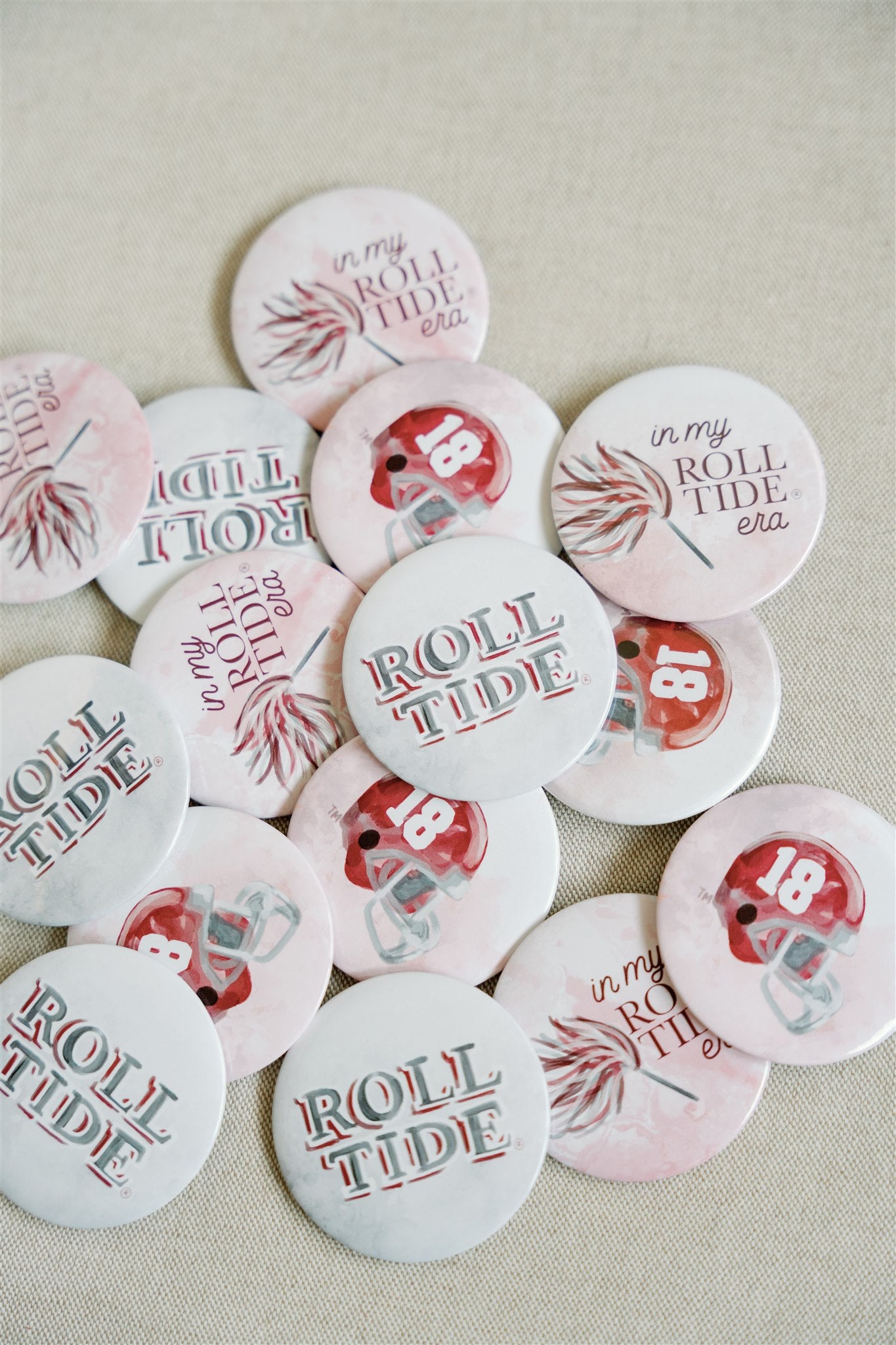 Buttons with watercolor illustrations themed to University of Alabama Football.