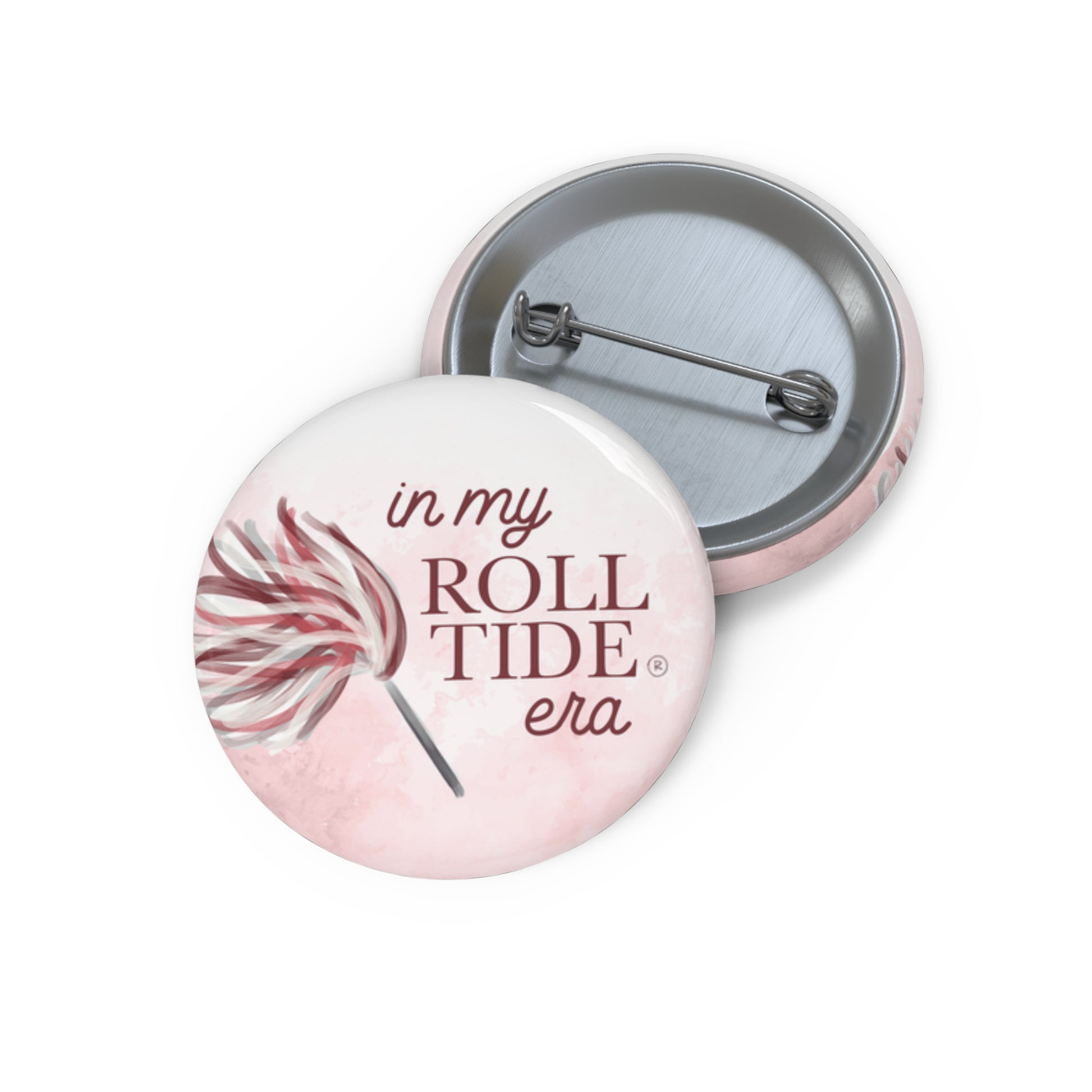 University of Alabama button with "in my Roll Tide era" on it.