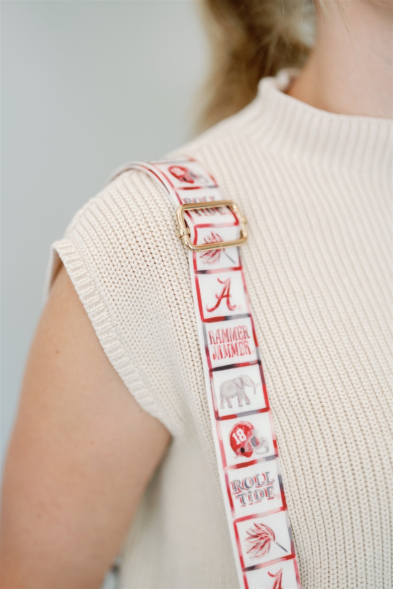Clear bag with University of Alabama themed strap.