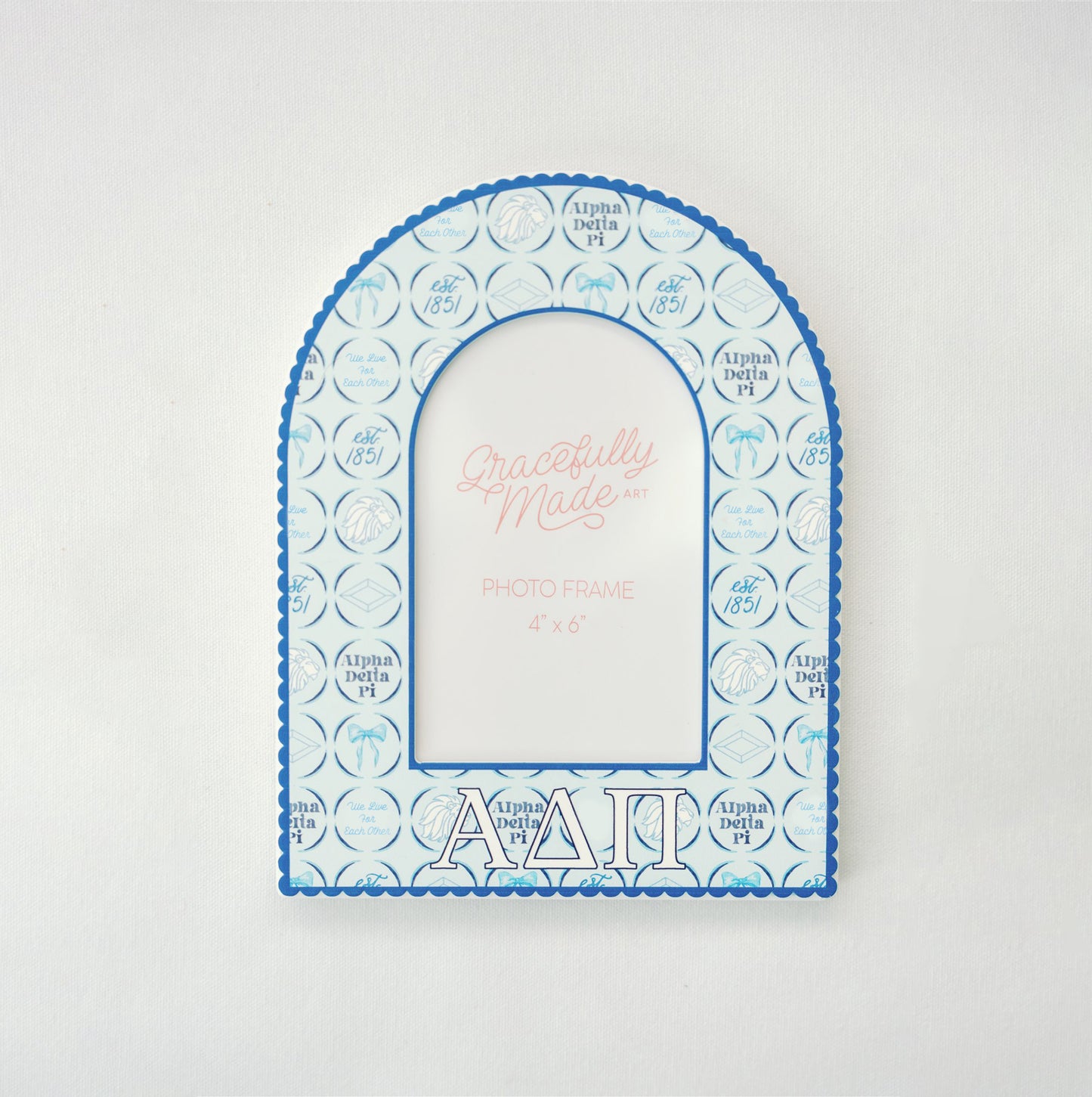 Decorative photo frame with Alpha Delta Pi blue and white design on a light gray background