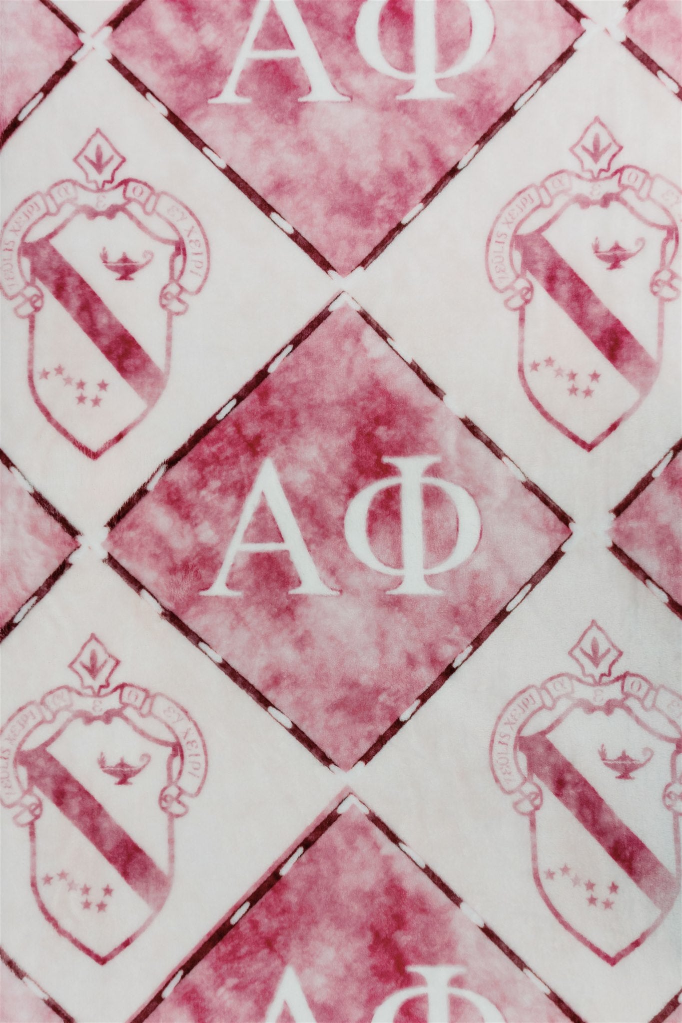 Pattern with 'A Phi' letters and crest-like designs on a white and red background