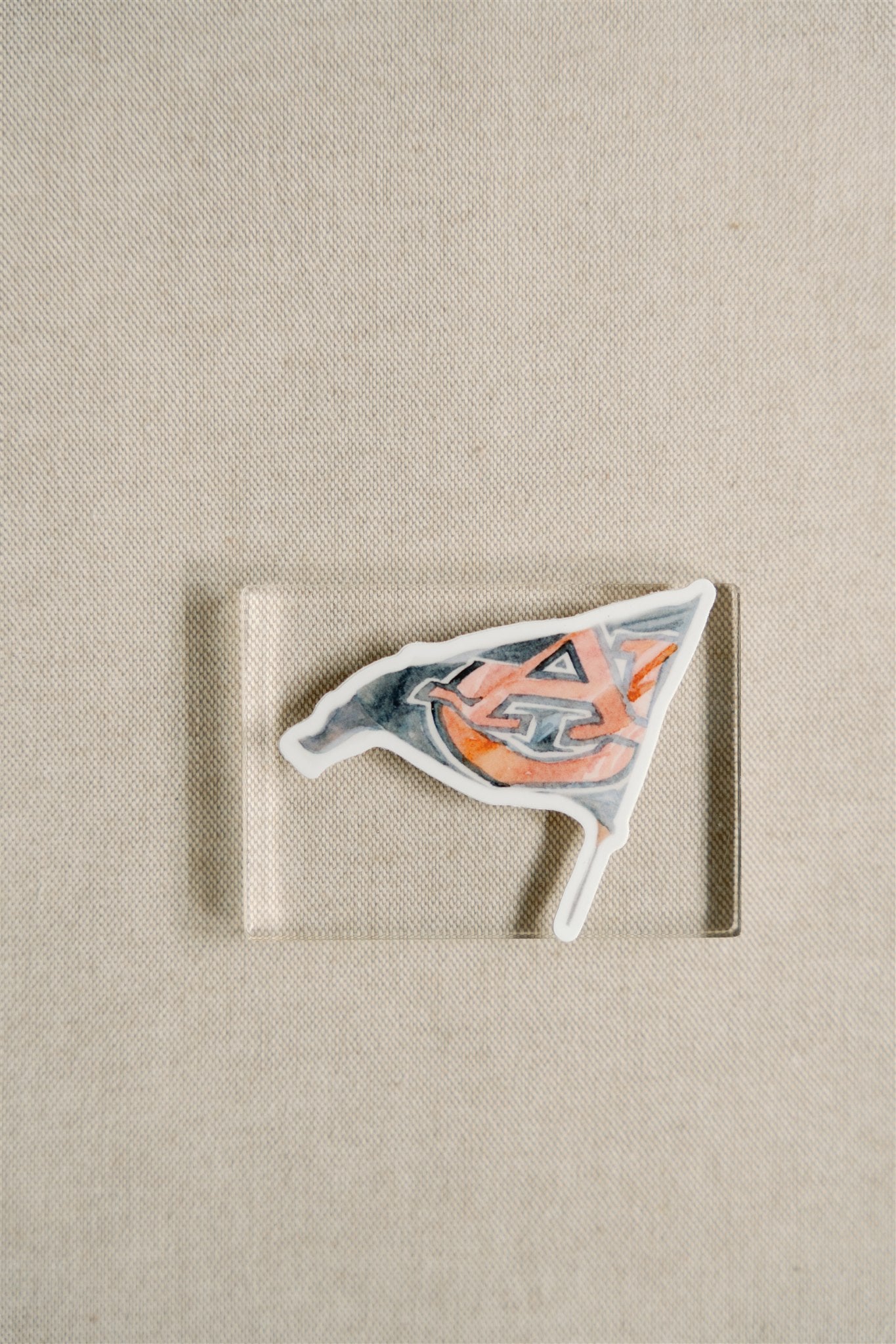 Sticker of a watercolor Auburn flag.