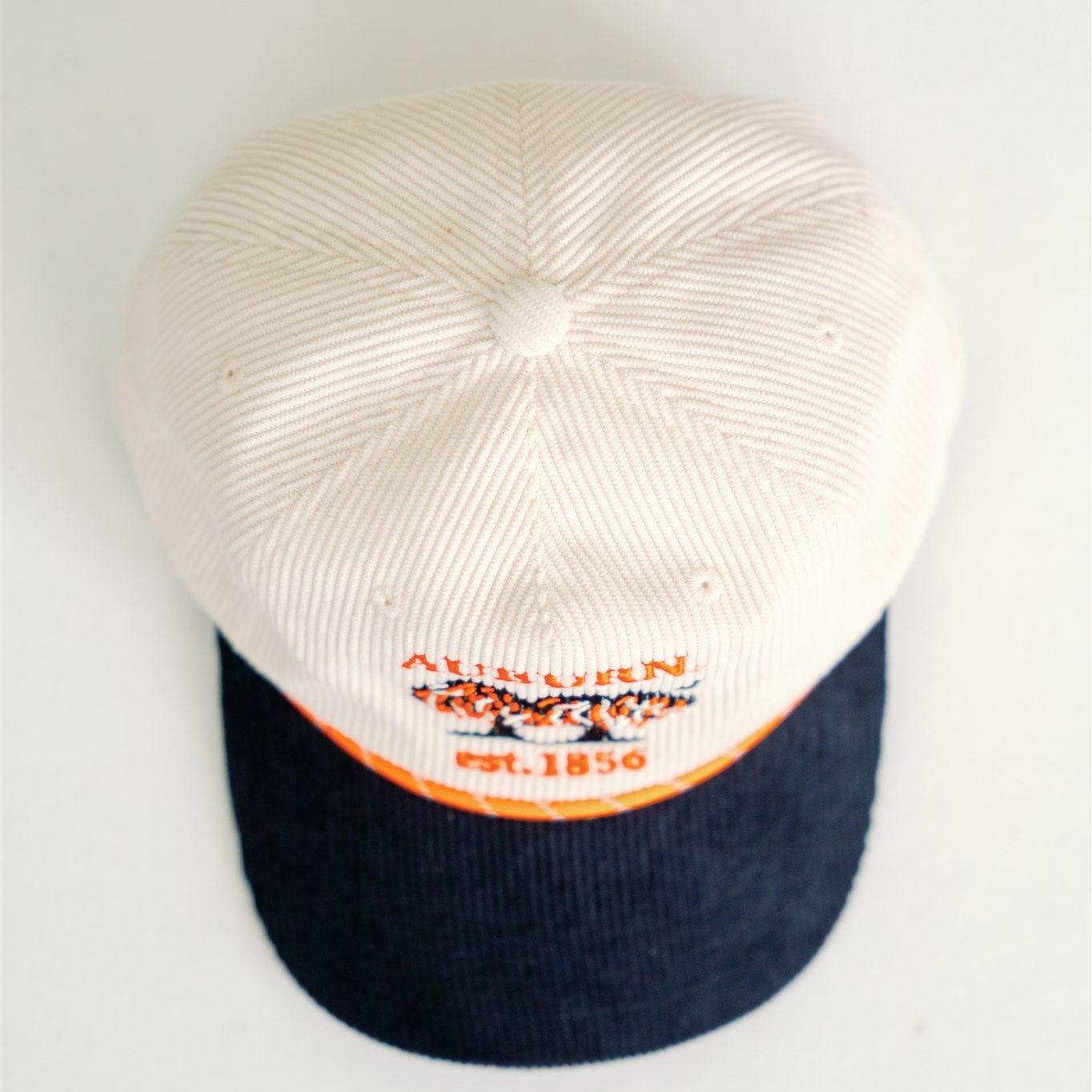 White and navy Auburn baseball cap on a white background