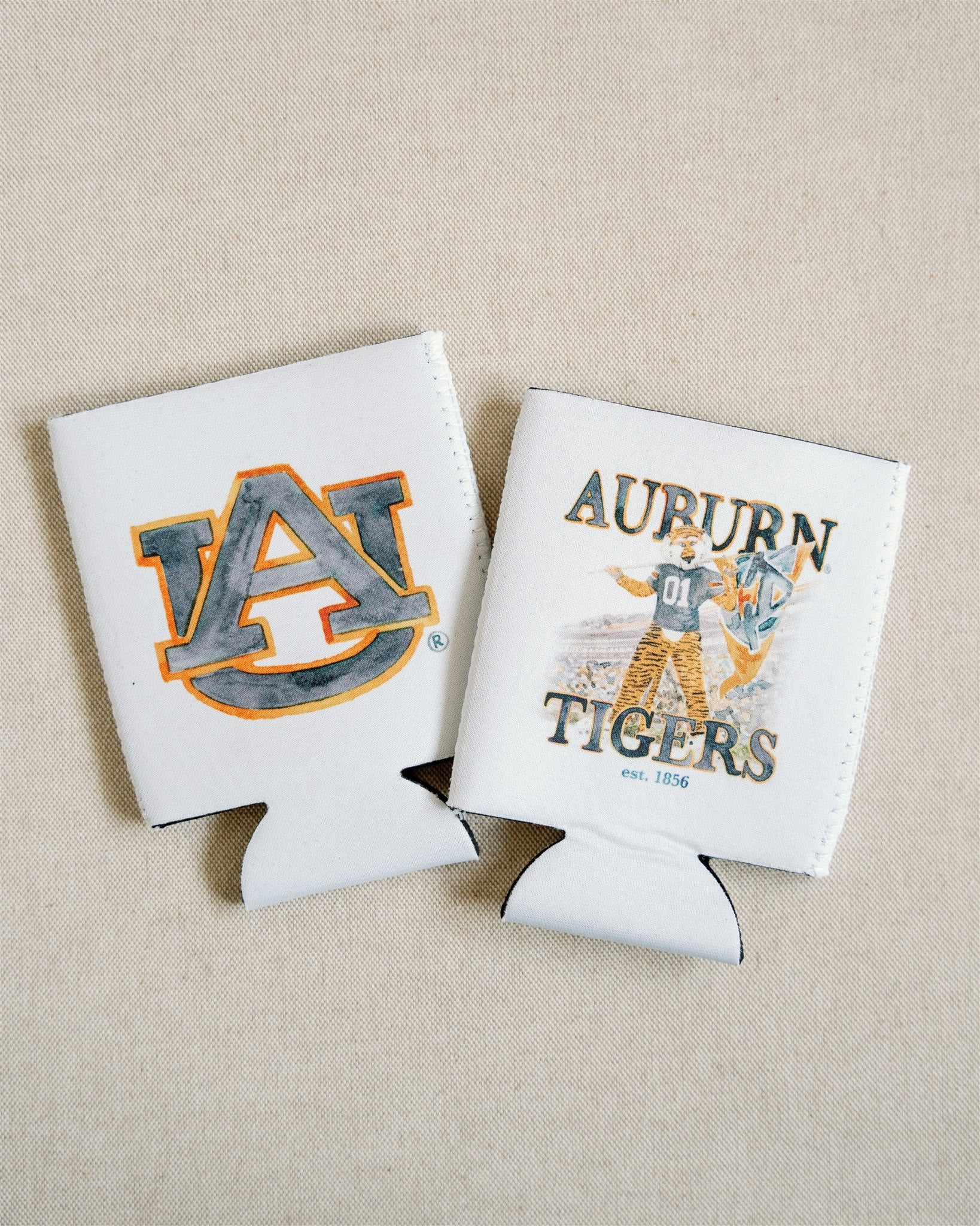 White Koozie with the Auburn University logo on one side and Aubie on the other.