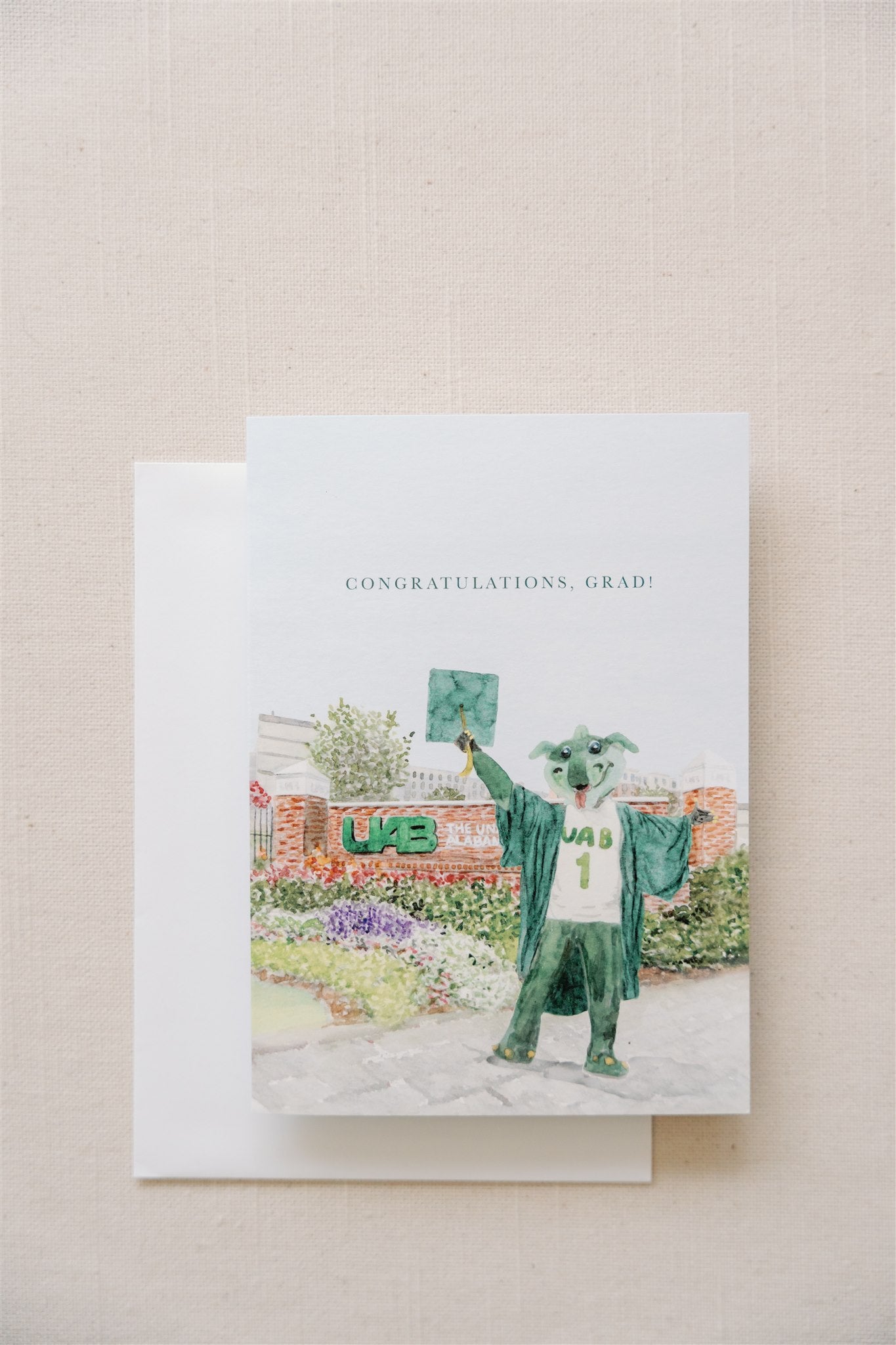 Greeting card with watercolor art of the UAB mascot and sign on it.