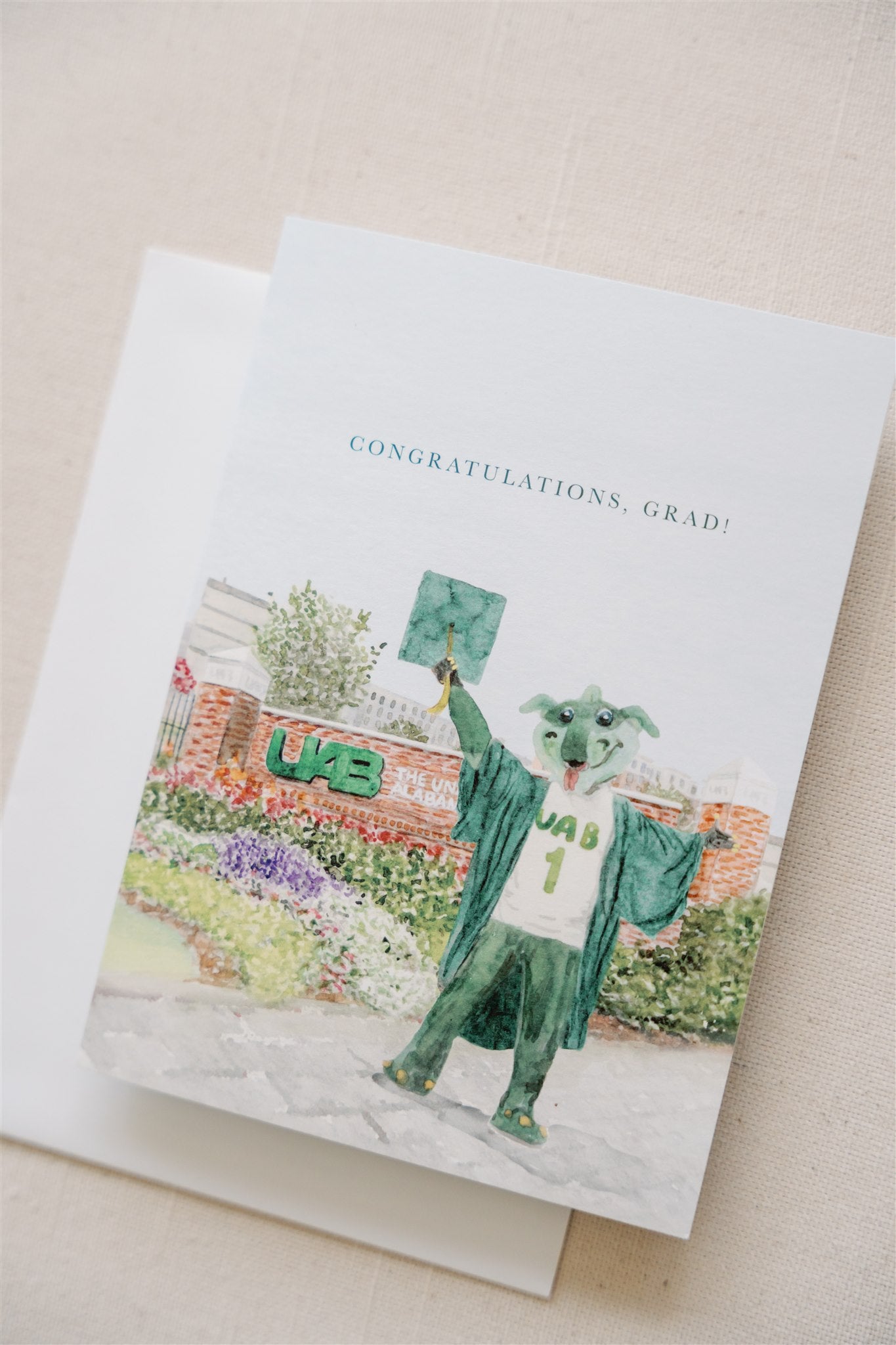Greeting card with watercolor art of the UAB mascot and sign on it.