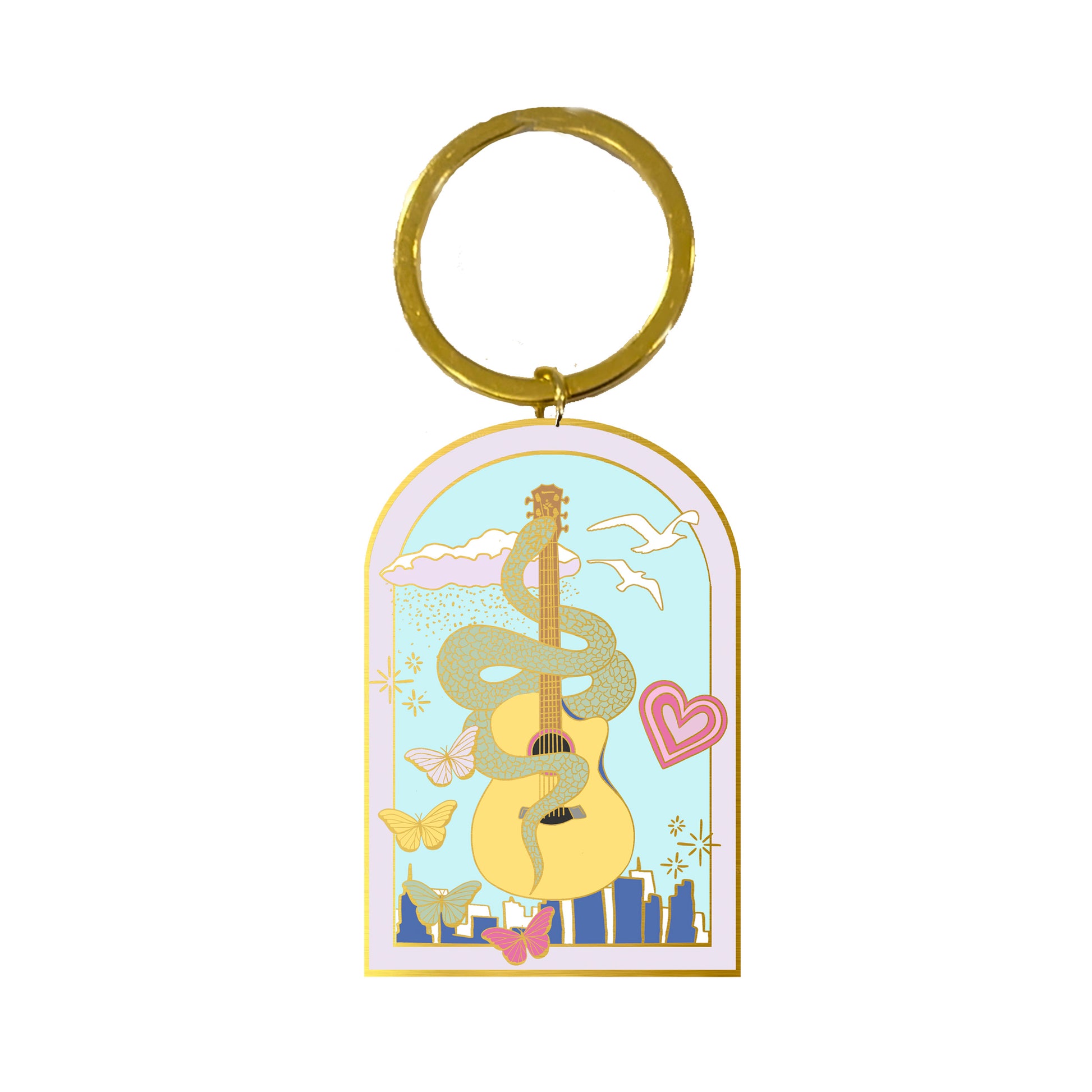 Enamel keychain with a gold loop and a guitar with a snake wrapped around it and the New York skyline in the background.