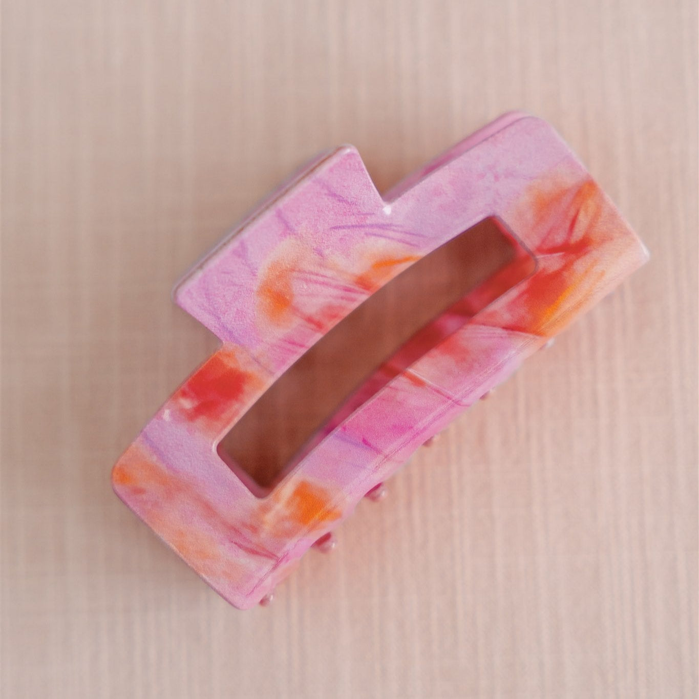 Pink and orange hair claw clip.
