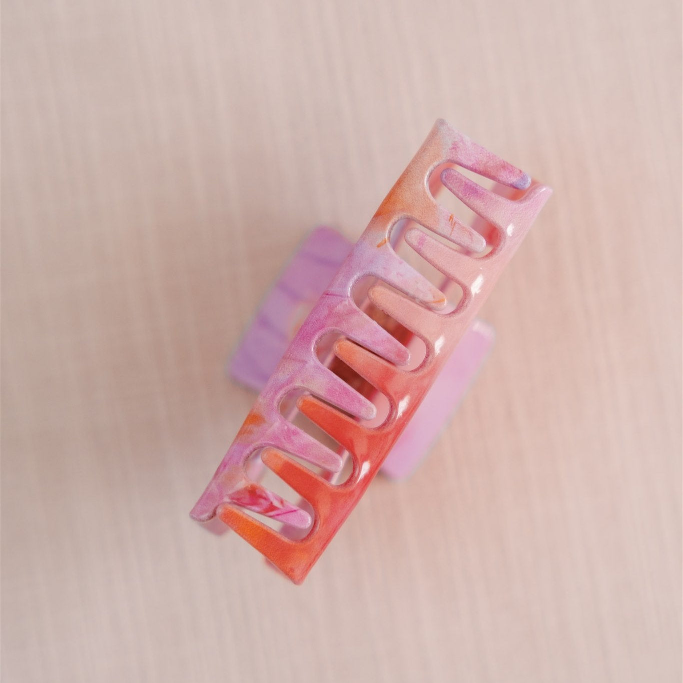 Pink and orange hair claw clip.