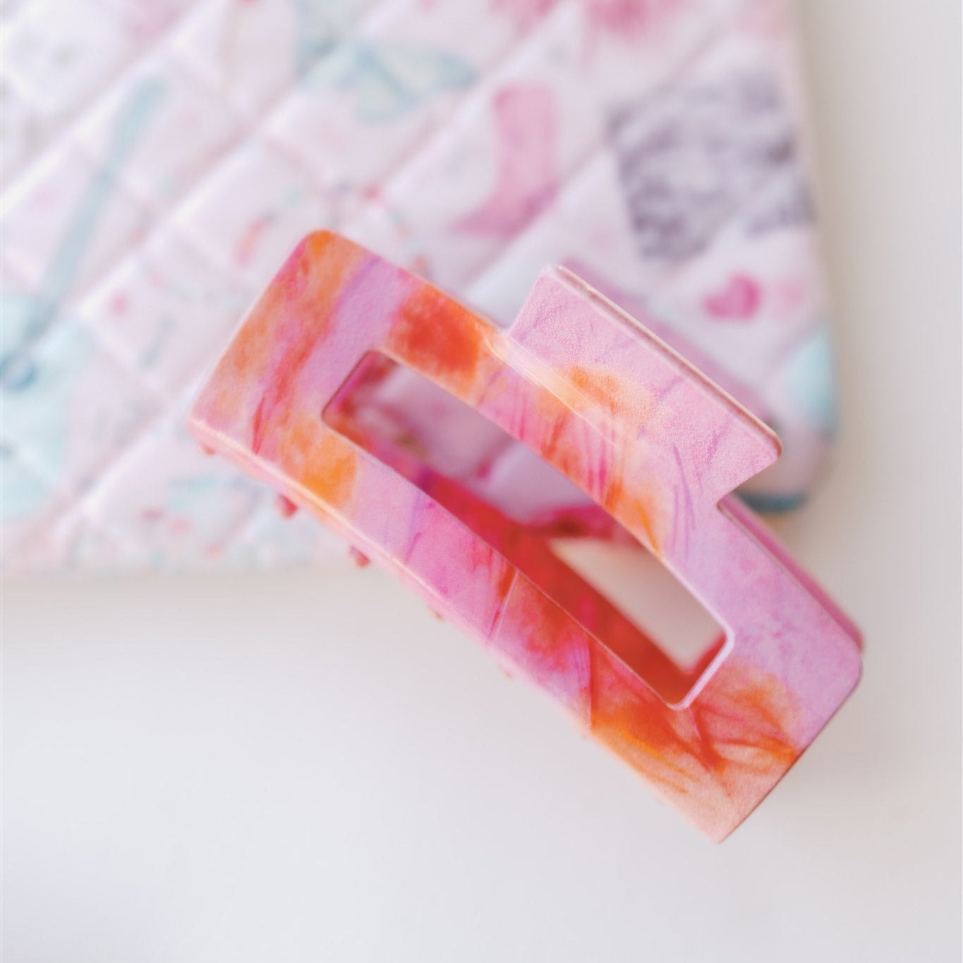 Pink and orange hair claw clip.