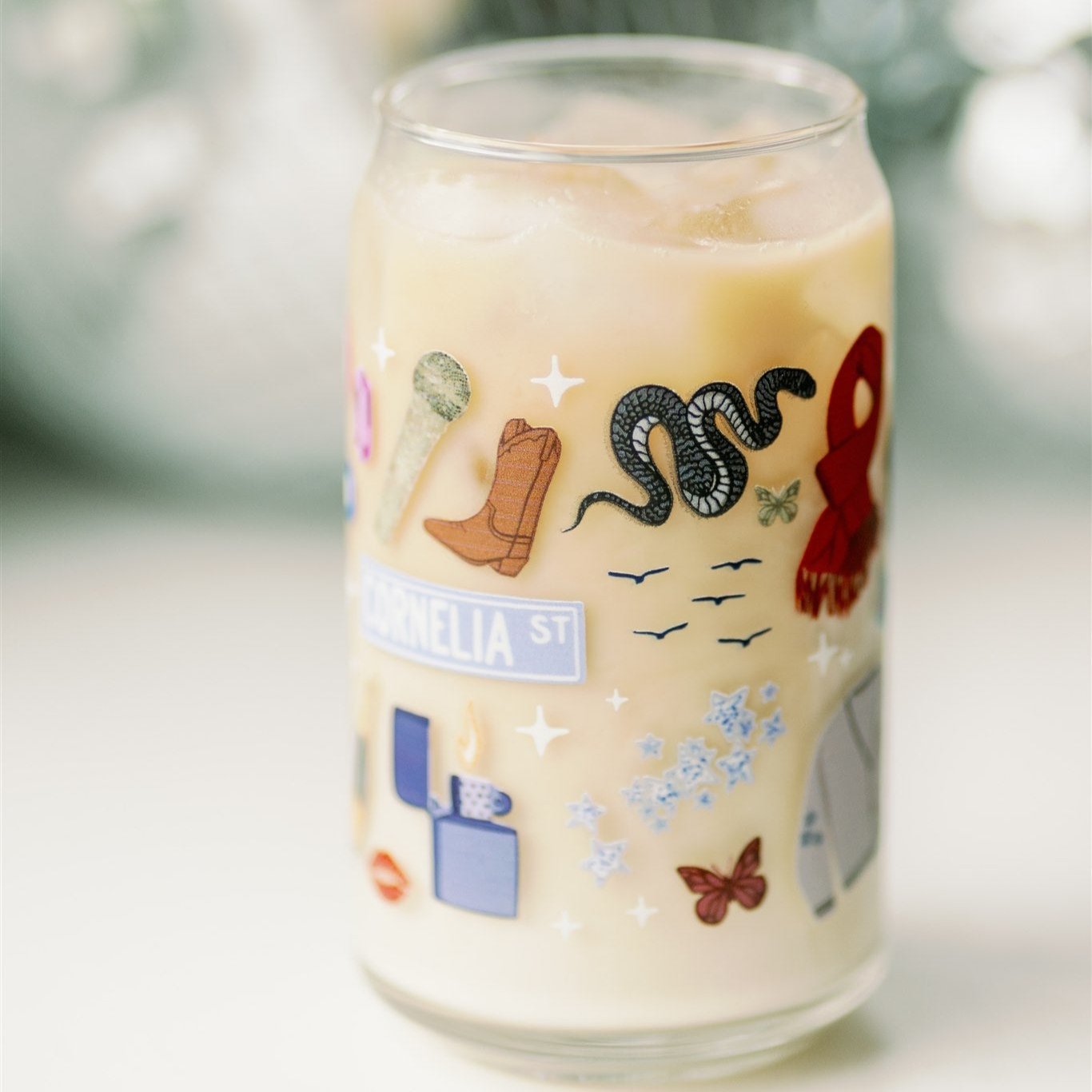 Clear glass with Taylor Swift symbols on it.