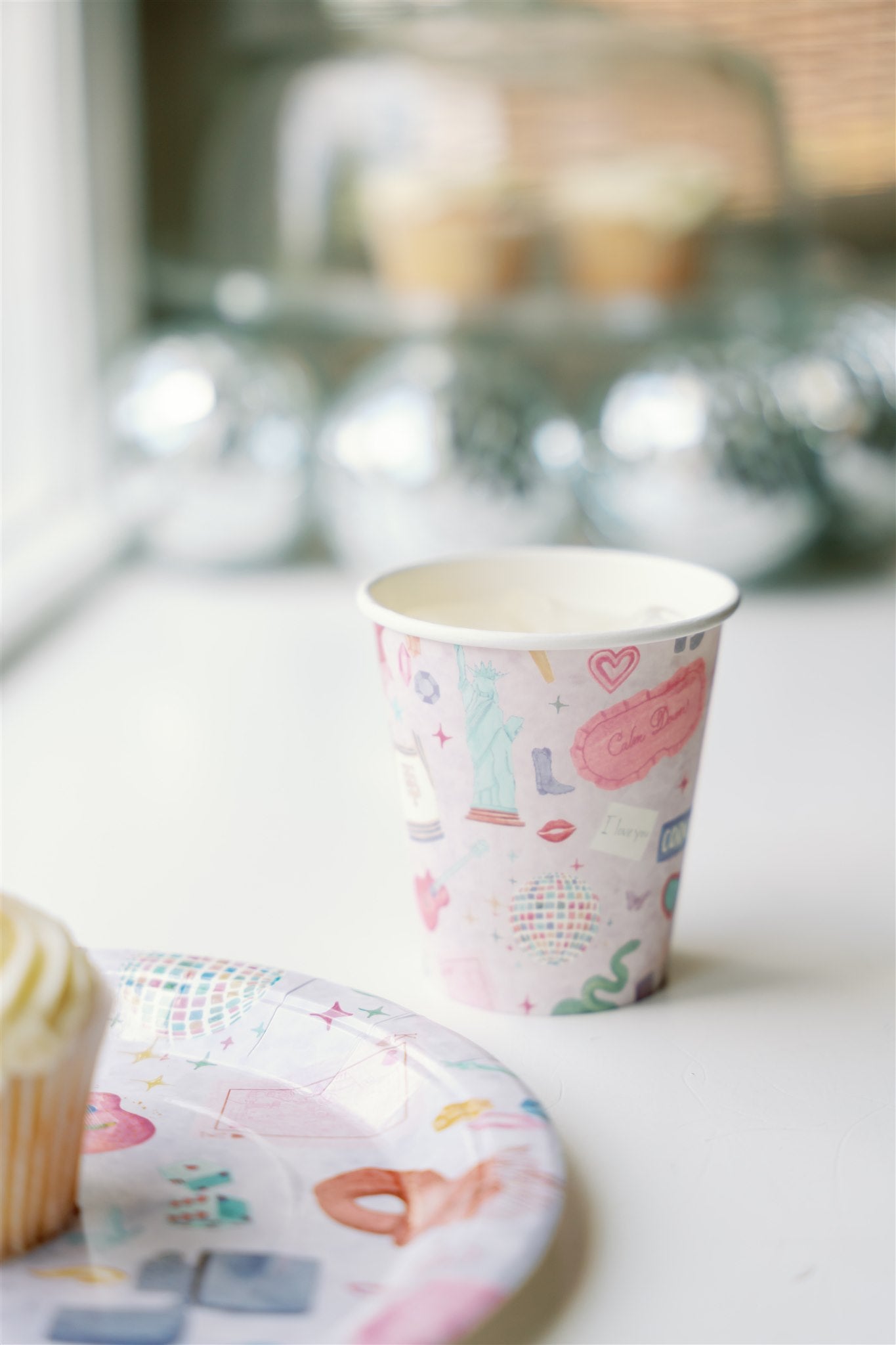 Light purple paper up patterned with original watercolor art of Taylor Swift symbols.