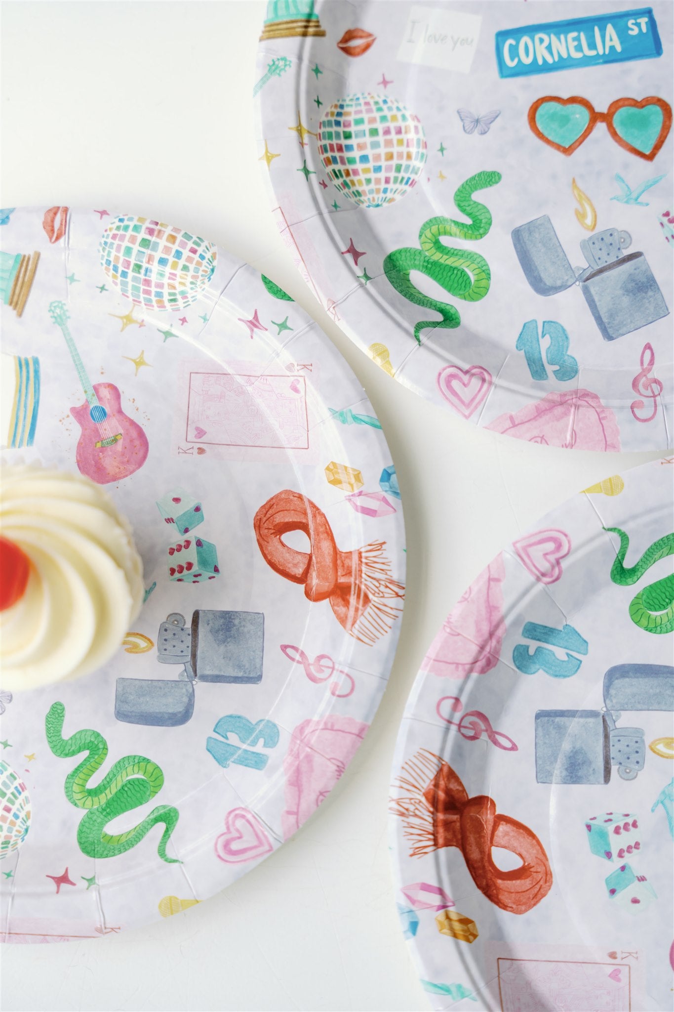 Light purple paper plate with original watercolor art of Taylor Swift icons.