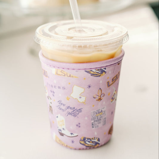 Purple coffee sleeve with watercolor LSU symbols.