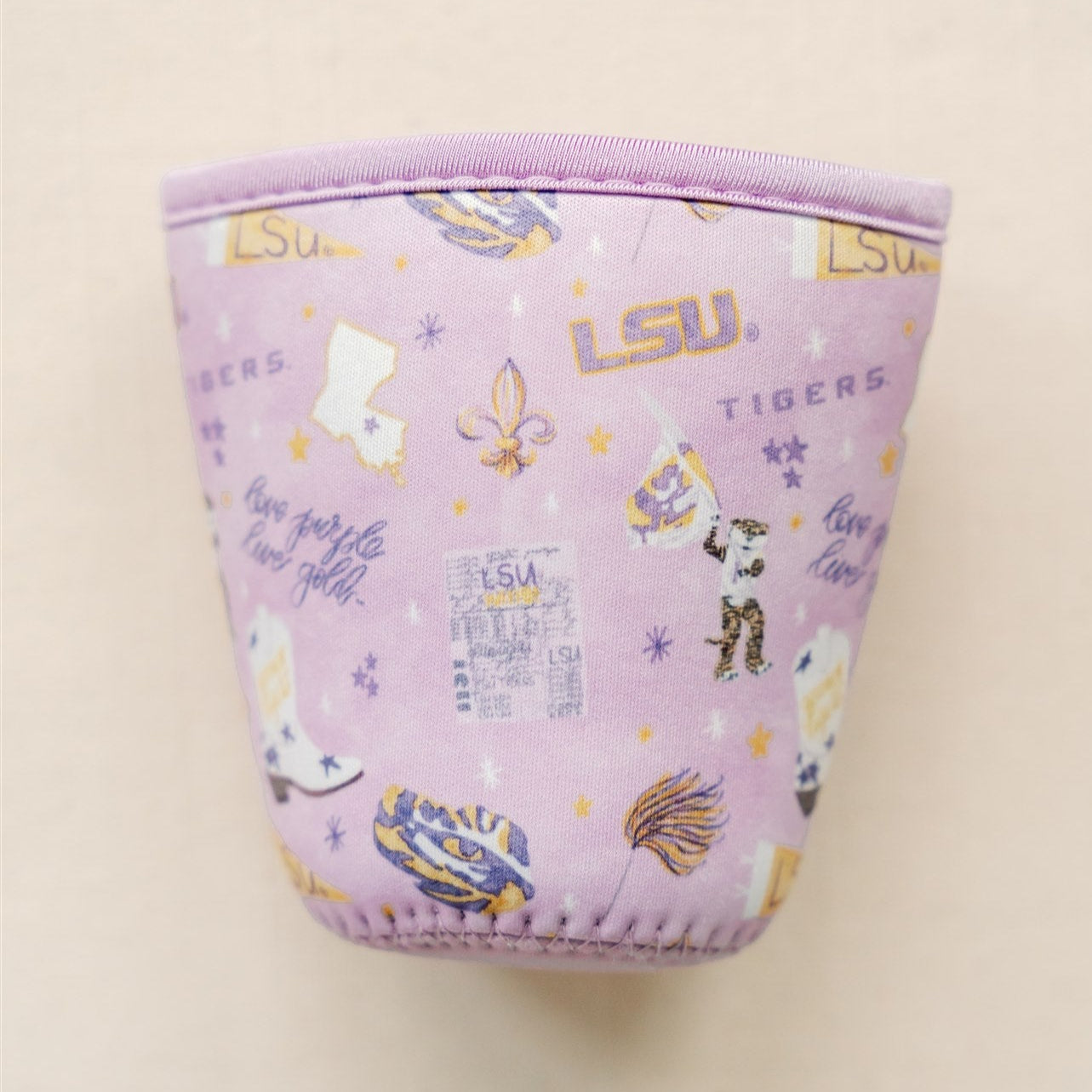 Purple coffee sleeve with watercolor LSU symbols.