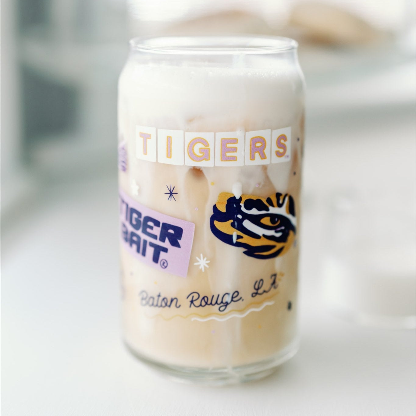 Glass Cup with LSU Tiger symbols on it.