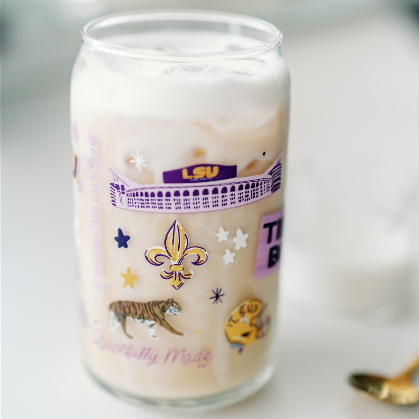 Glass Cup with LSU Tiger symbols on it.