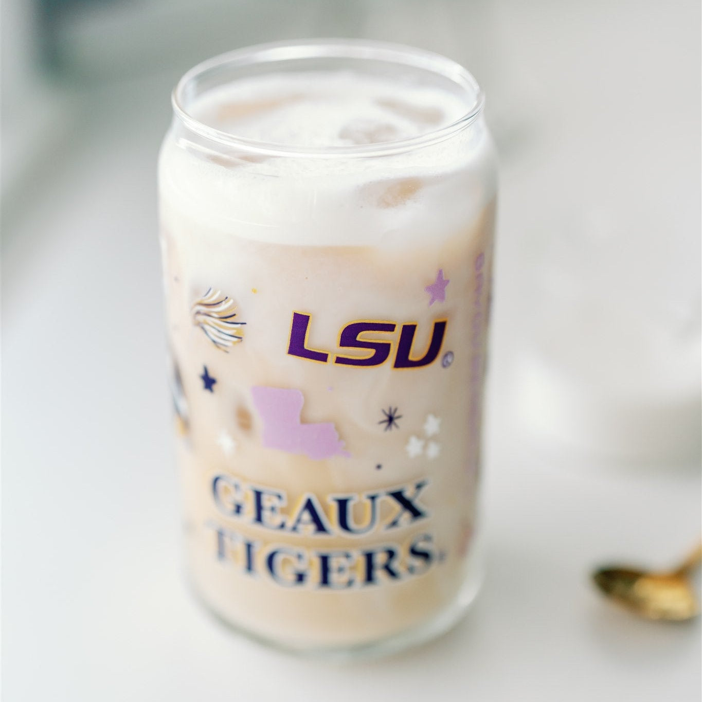 Glass Cup with LSU Tiger symbols on it.