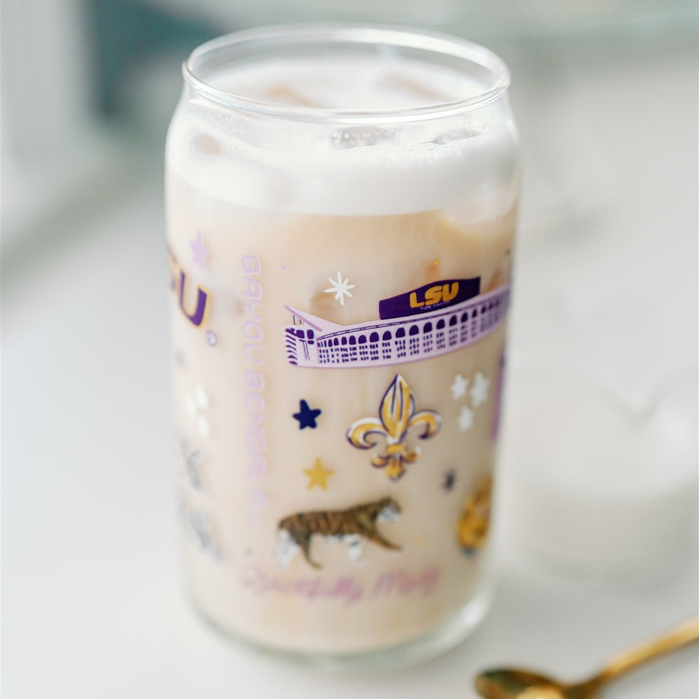 Glass Cup with LSU Tiger symbols on it.