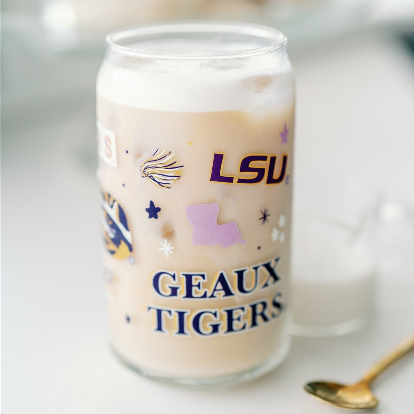 Glass Cup with LSU Tiger symbols on it.