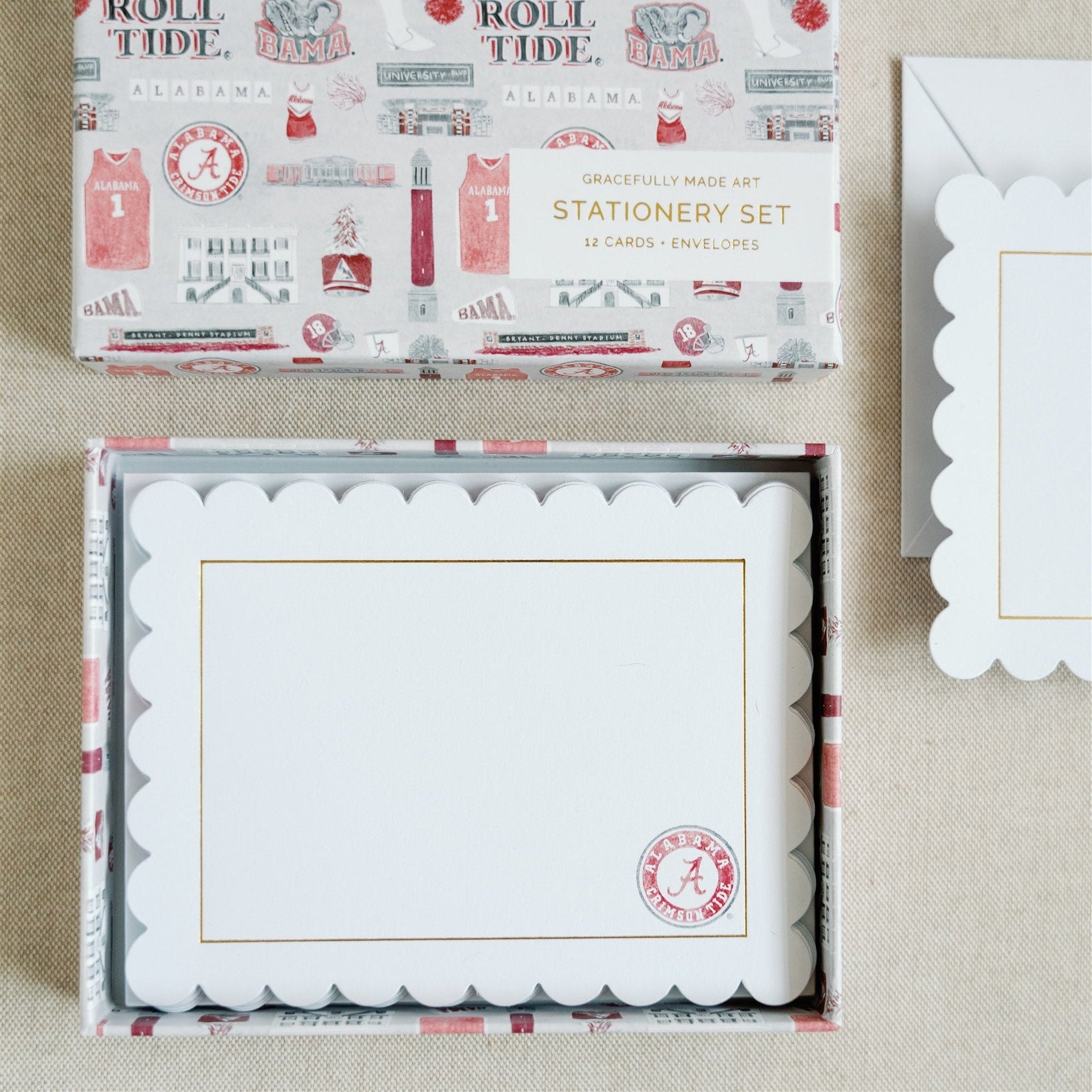 White notecards with a scalloped edge, gold detail, and University of Alabama logo.