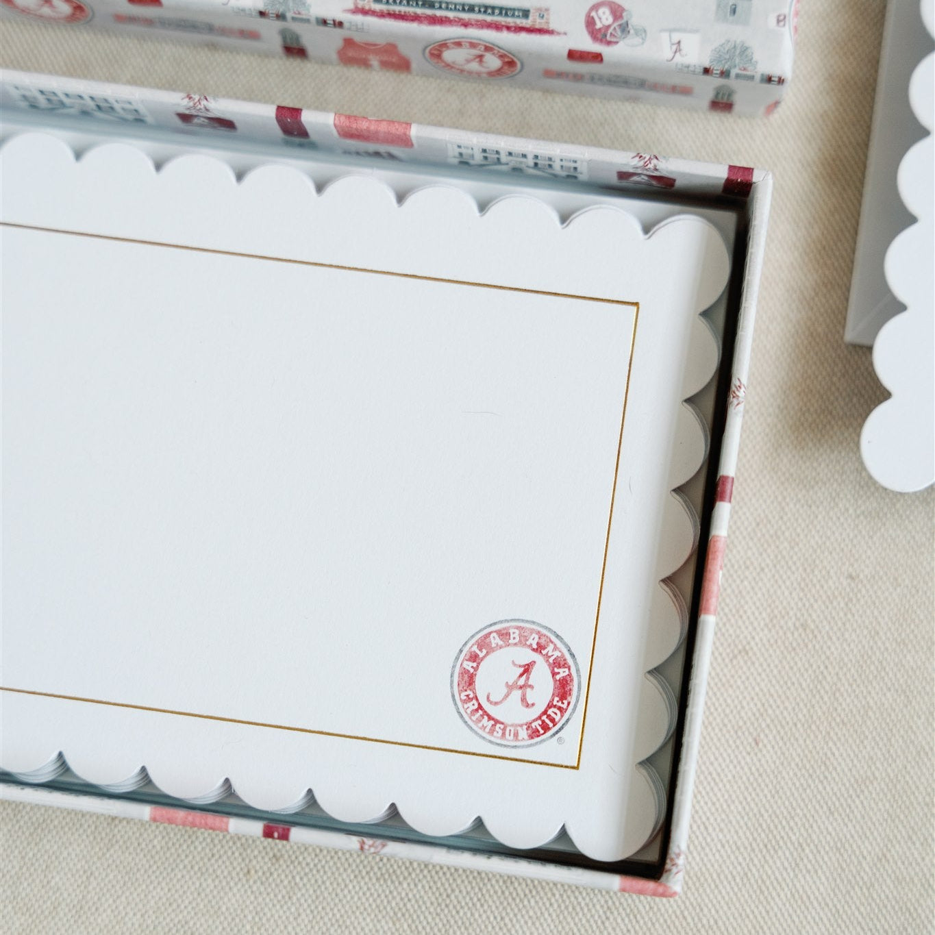 White notecards with a scalloped edge, gold detail, and University of Alabama logo.