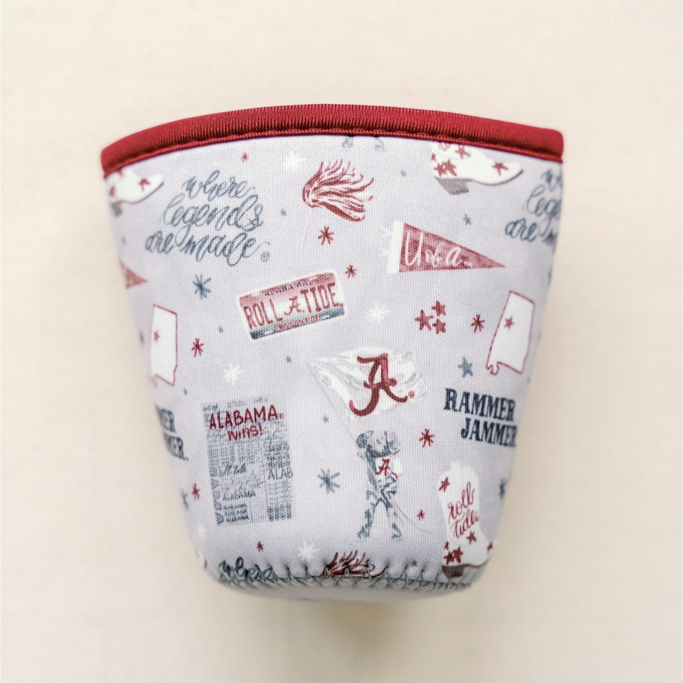 Light grey coffee sleeve with watercolor University of Alabama symbols.
