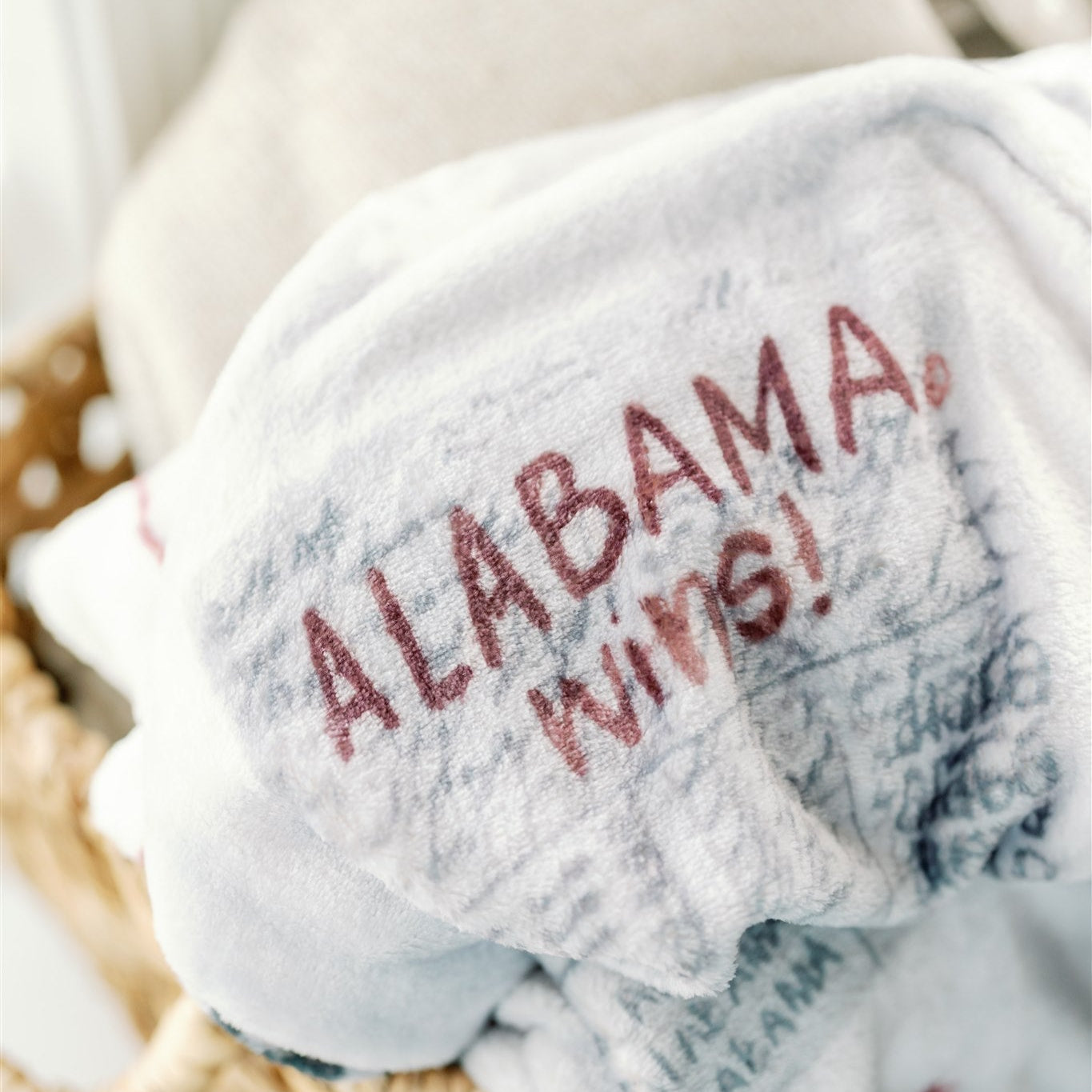 Light grey flannel fleece blanket themed to University of Alabama.