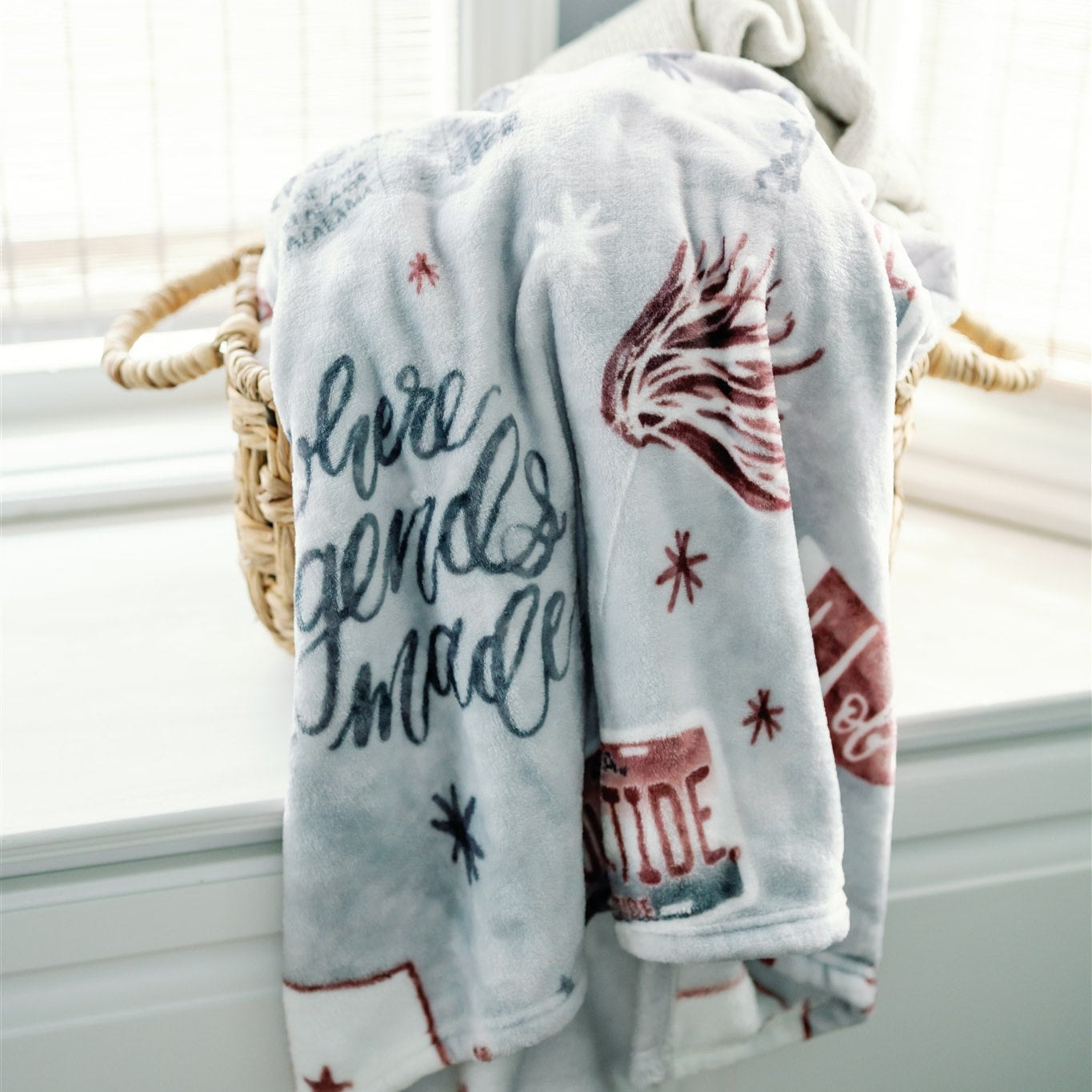 Light grey flannel fleece blanket themed to University of Alabama.