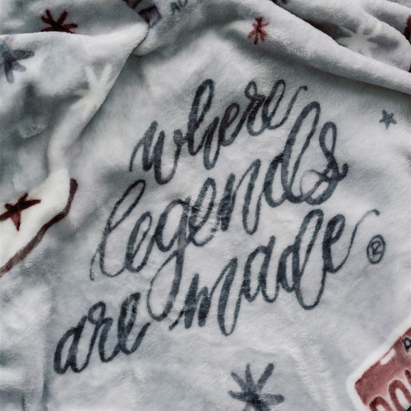 Light grey flannel fleece blanket themed to University of Alabama.