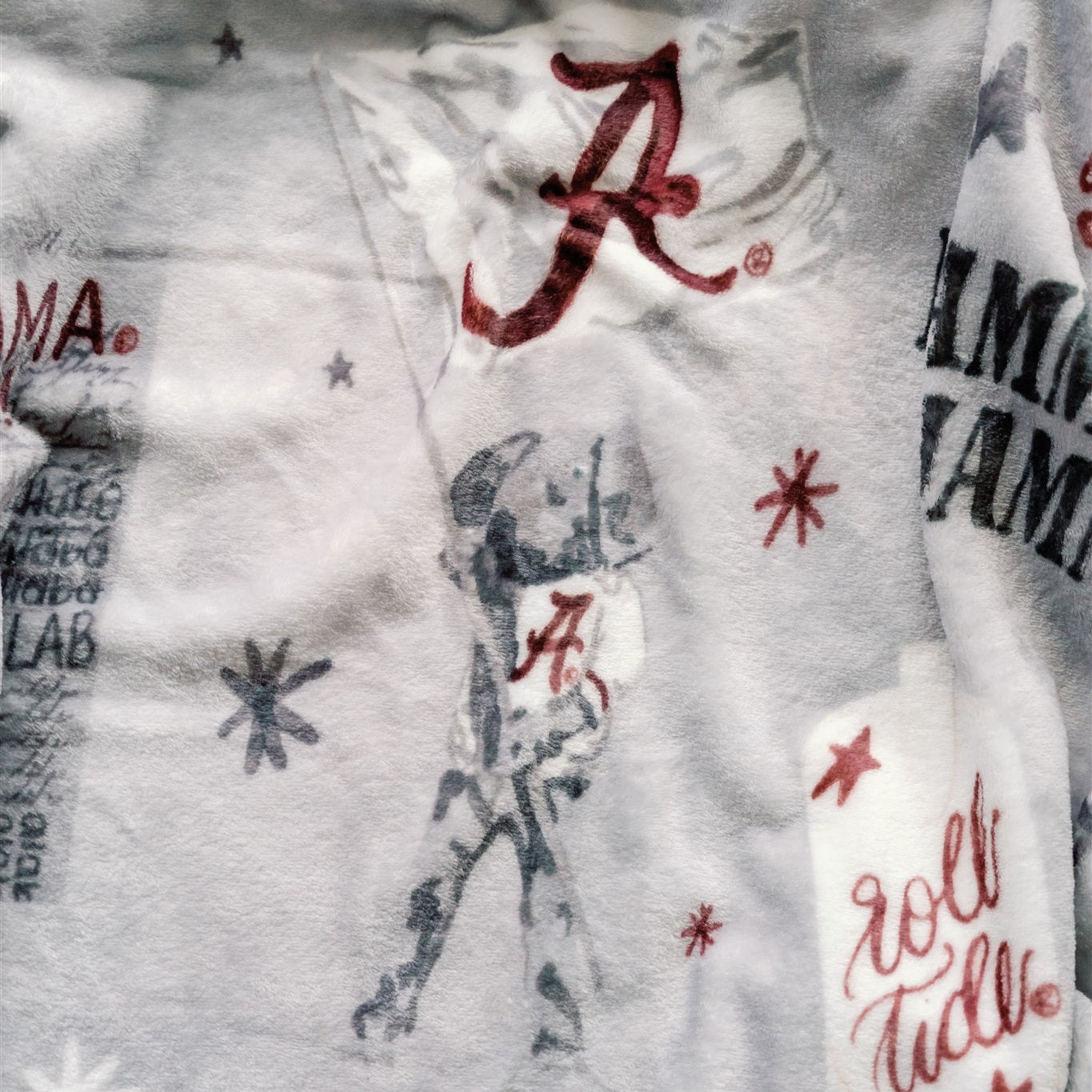 Light grey flannel fleece blanket themed to University of Alabama.