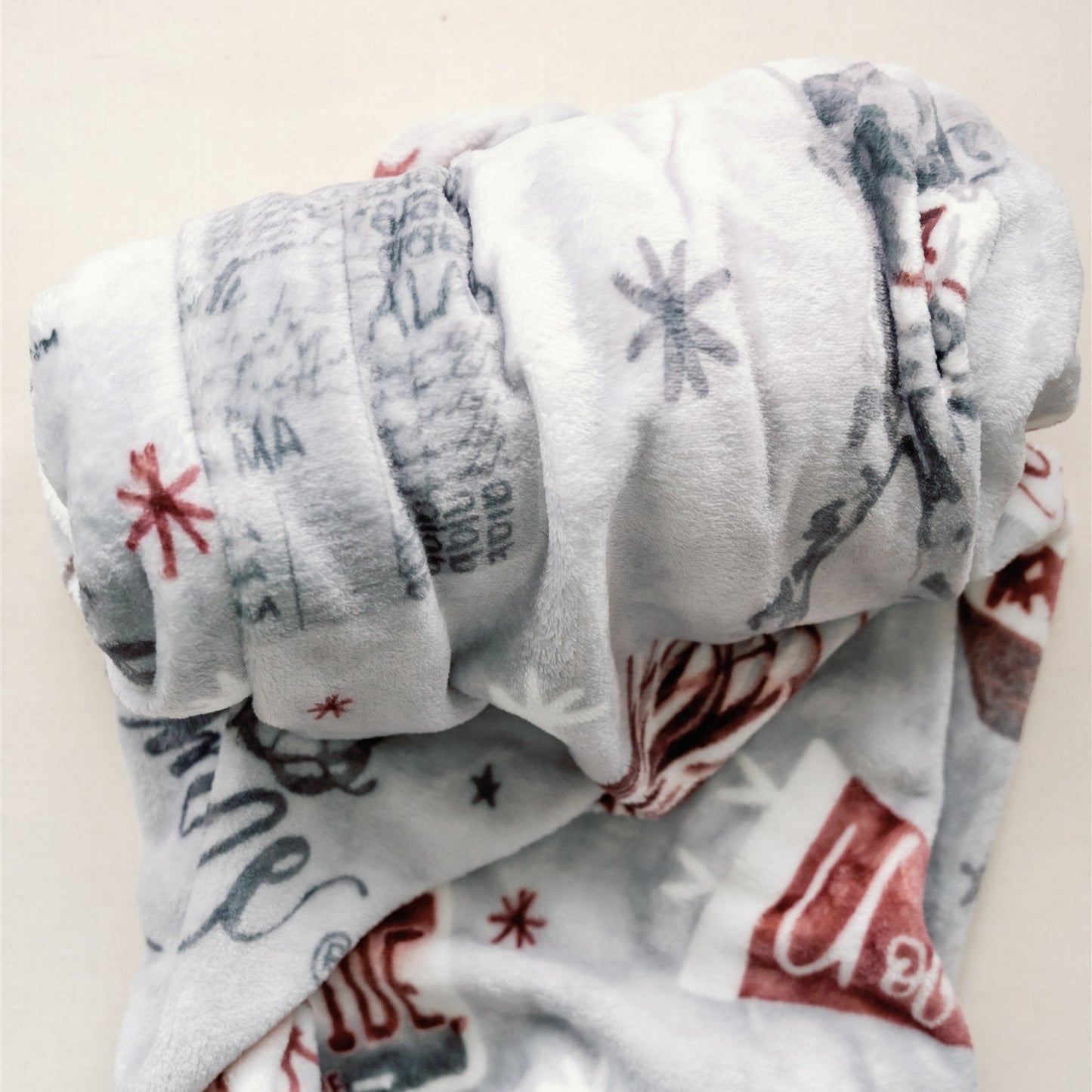 Light grey flannel fleece blanket themed to University of Alabama.