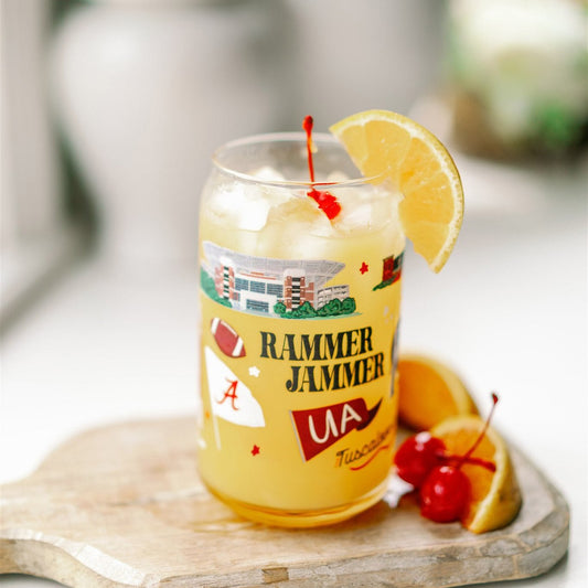 Clear glass with University of Alabama symbols on it.