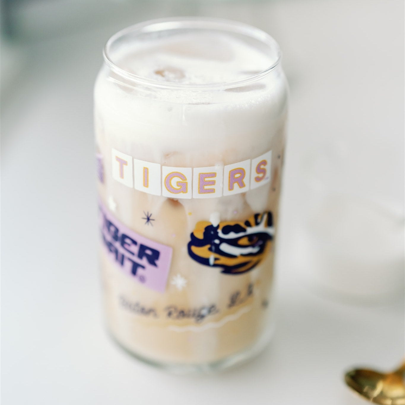 Glass Cup with LSU Tiger symbols on it.