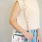 Clear bag with University of Alabama themed strap.