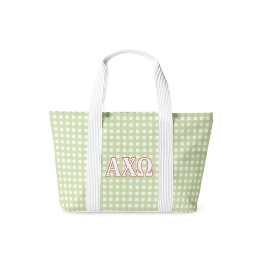 Green gingham tote bag with Alpha Chi Omega Greek letters on a white background
