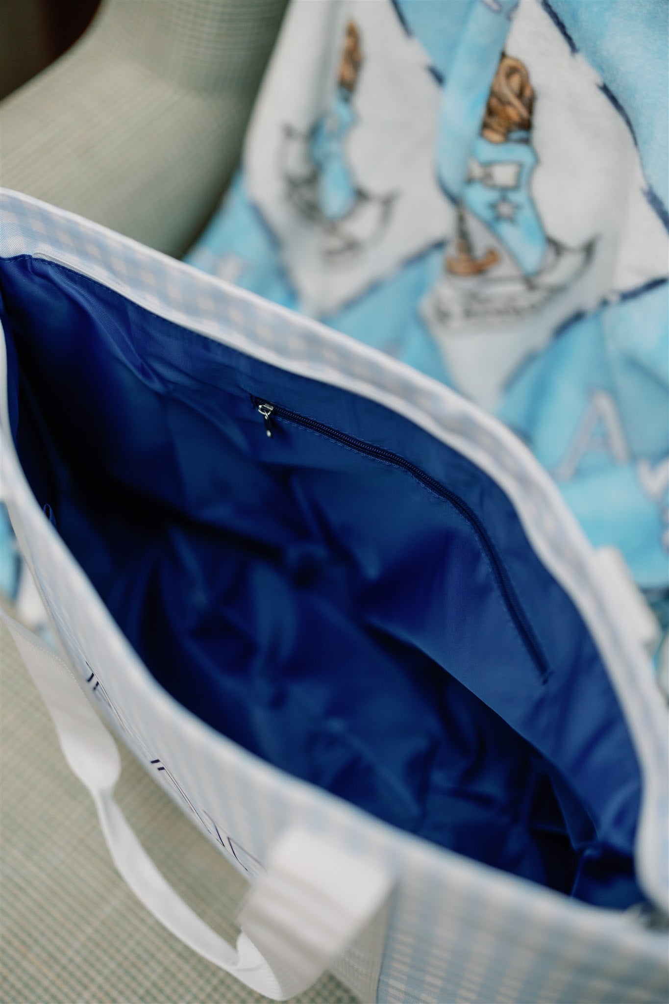 Close-up of the Alpha Delta Pi tote bag with a blue interior.