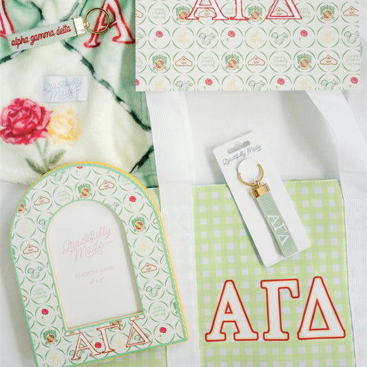 Collection of Alpha Gamma Delta themed items on a white background