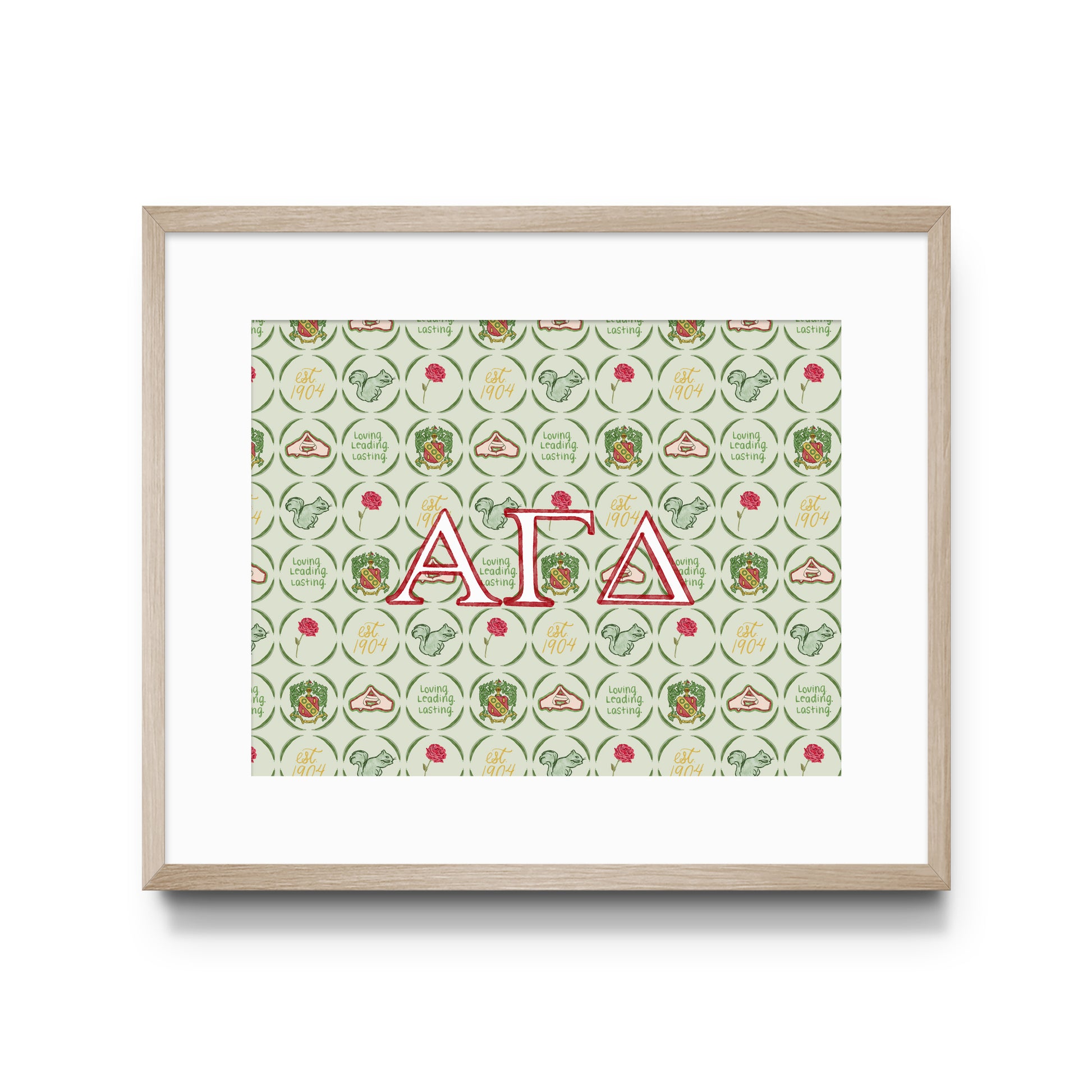 Framed artwork with Alpha Gamma Delta Greek letters and pattern on a white background