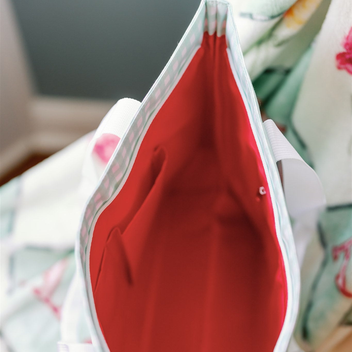 Close-up of the Alpha Gamma Delta tote bag's red interior lining.