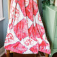 Red and gray patterned blanket with 'AOII' initials draped over a chair.