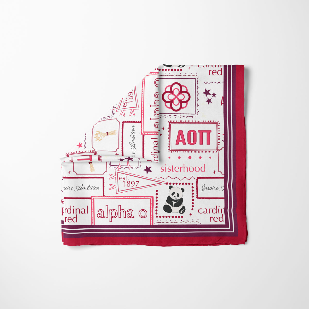 A folded white square scarf with a red and maroon printed design, featuring the text 'Alpha Omicron Pi', 'sisterhood', and a panda illustration, displayed on a clean white background.