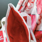 Close-up of the Alpha Omicron Pi tote bag's interior red liner.