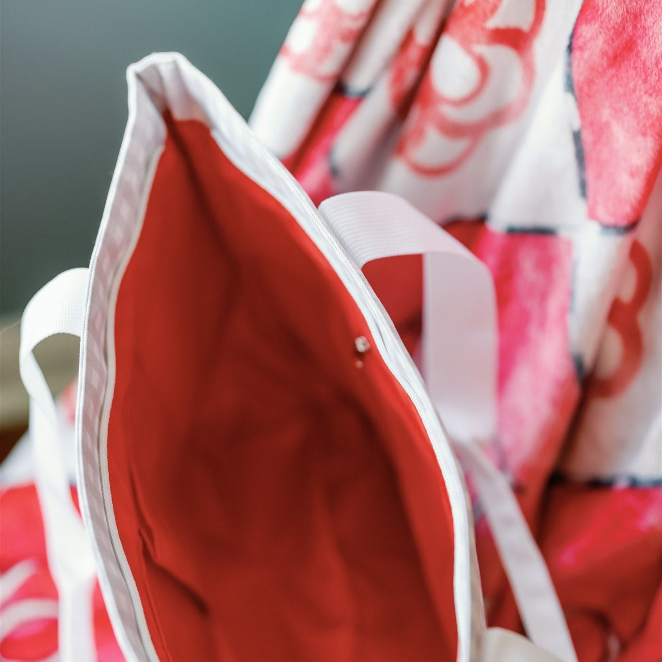 Close-up of the Alpha Omicron Pi tote bag's interior red liner.