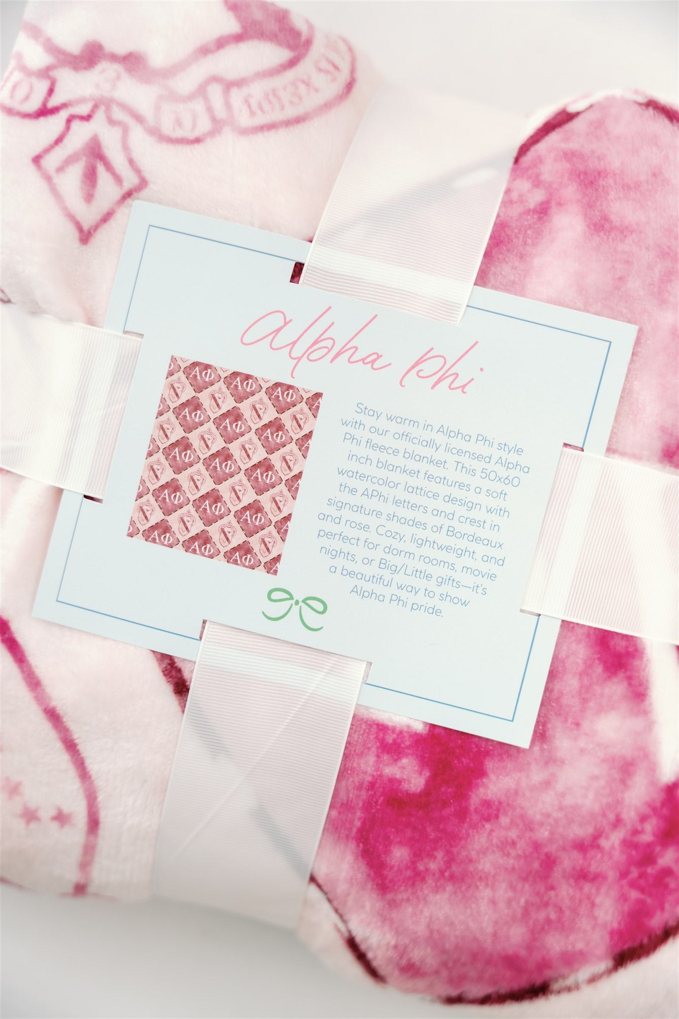 Alpha Phi card on the back of a flannel fleece blanket describing the Gracefully Made Art mission