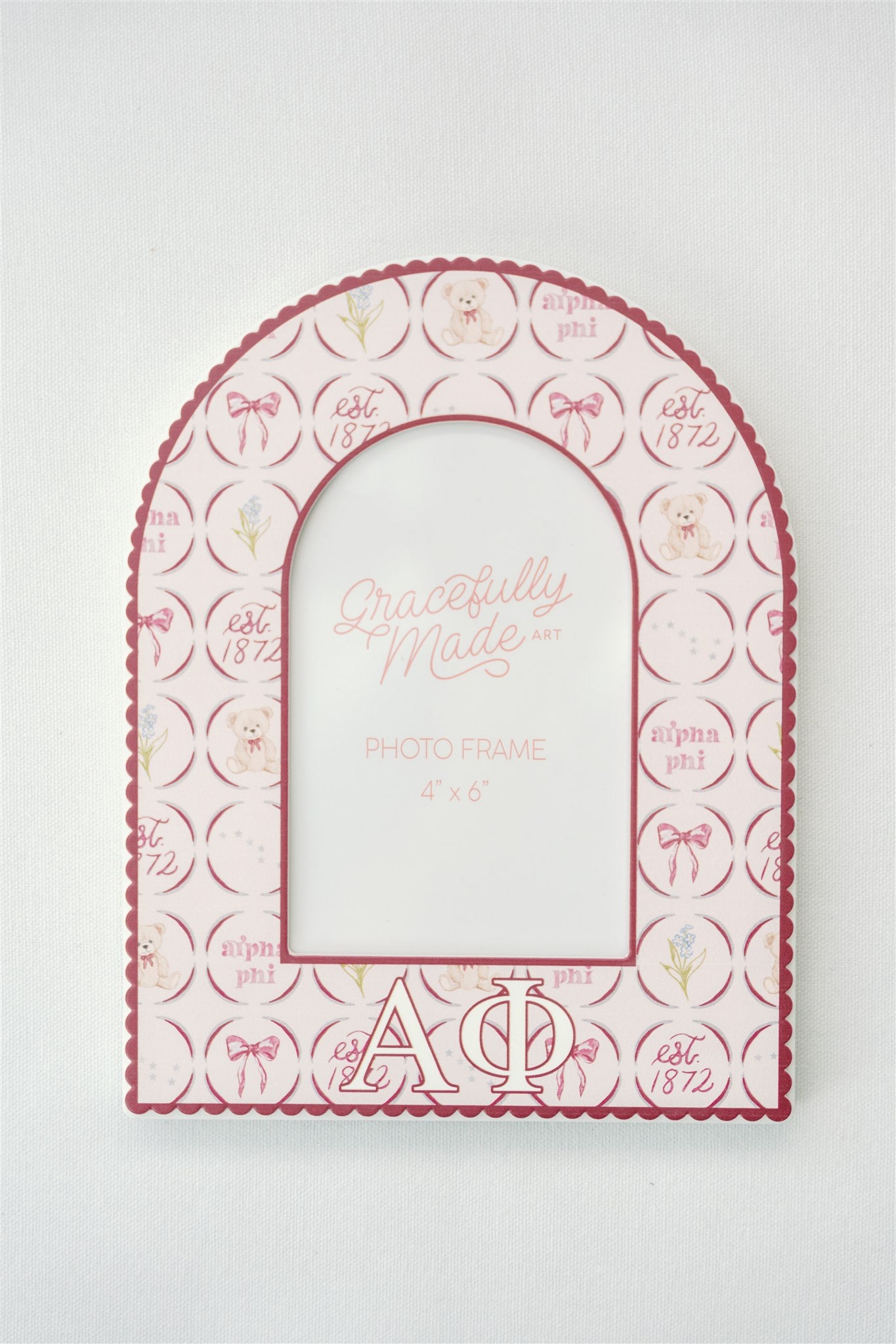 Decorative photo frame with Alpha Phi sorority designs and text on a white background