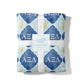Folded blanket with dark and light blue diamond pattern and 'AEΣΔ' symbols
