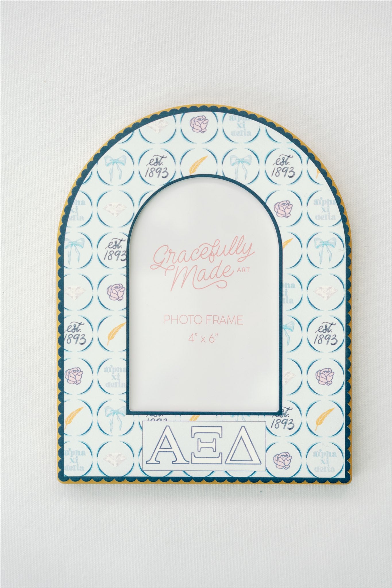 Decorative photo frame with Alpha Xi Delta patterns and Greek letters on a white background