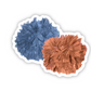 Sticker of an orange and blue pom pom.