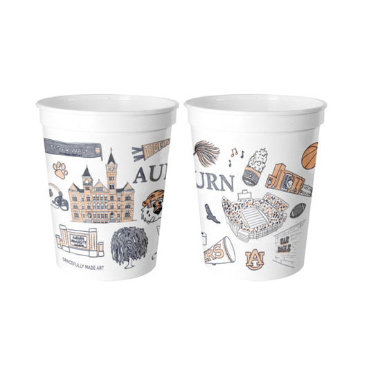 White plastic cups showcasing watercolor illustrations of popular Auburn landmarks & icons.